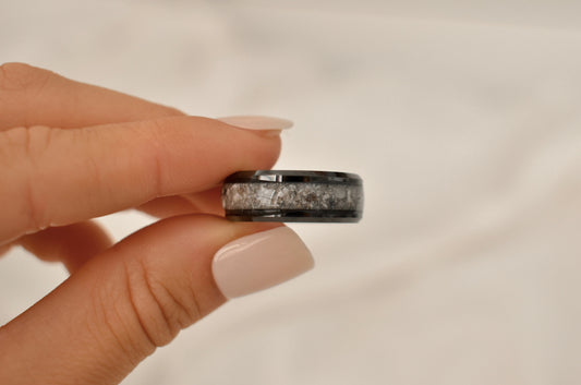 Black cremation ring with a unique silver and white inlay, designed as a personalized keepsake for ashes.