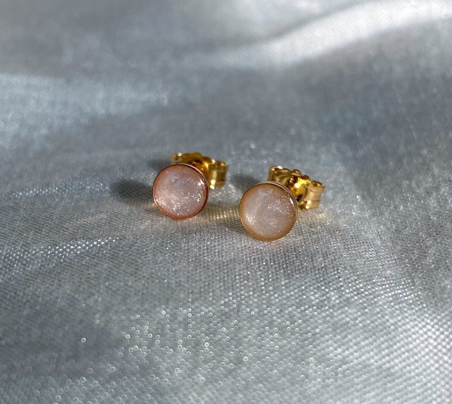 Minimalist gold stud cremation earrings with a round, pearlescent gemstone, a delicate memorial jewelry keepsake for a loved one or a pet