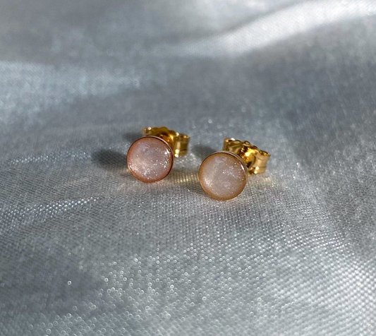 Minimalist gold stud cremation earrings with a round, pearlescent gemstone, a delicate memorial jewelry keepsake for a loved one or a pet